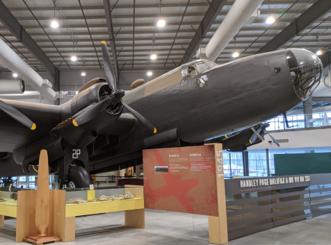 an airplane is on display in a museum.