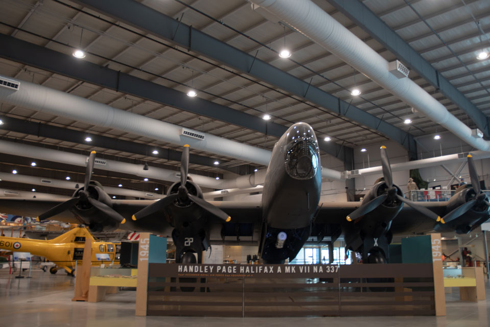 a museum filled with lots of airplanes on display.