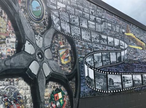 a large mural of a street with a lot of pictures on it.