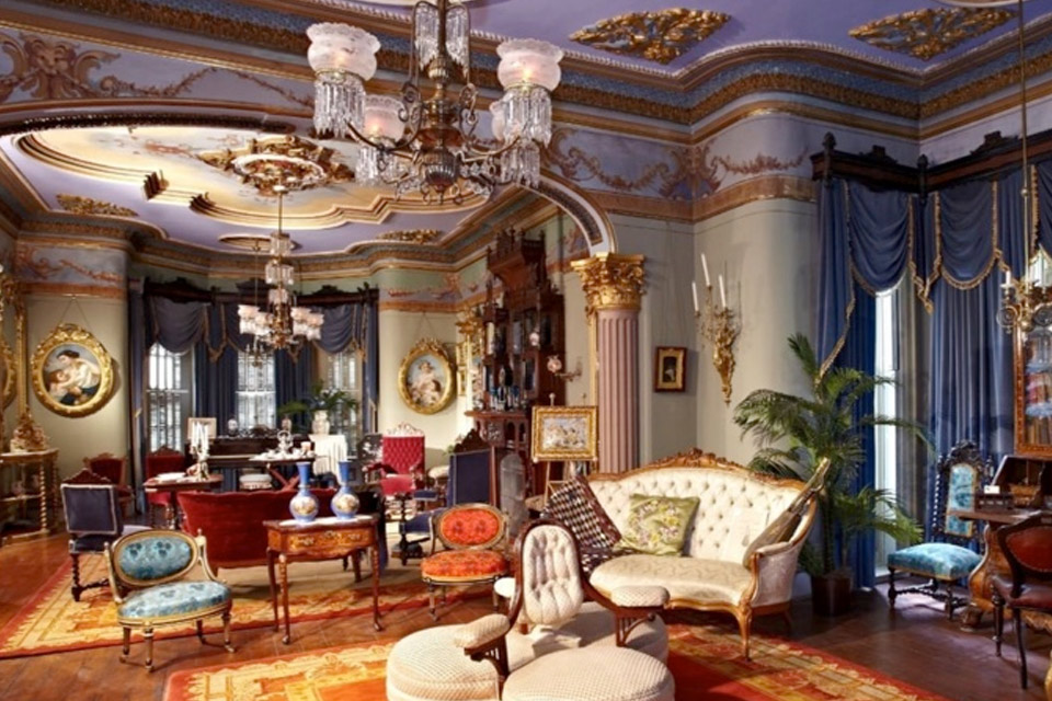 an ornate living room with ornate furniture.