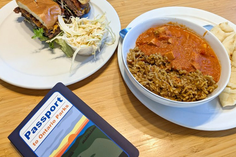 two bowls of food on a table next to a passport card.