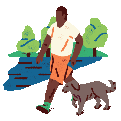 A man walking his dog in a park.