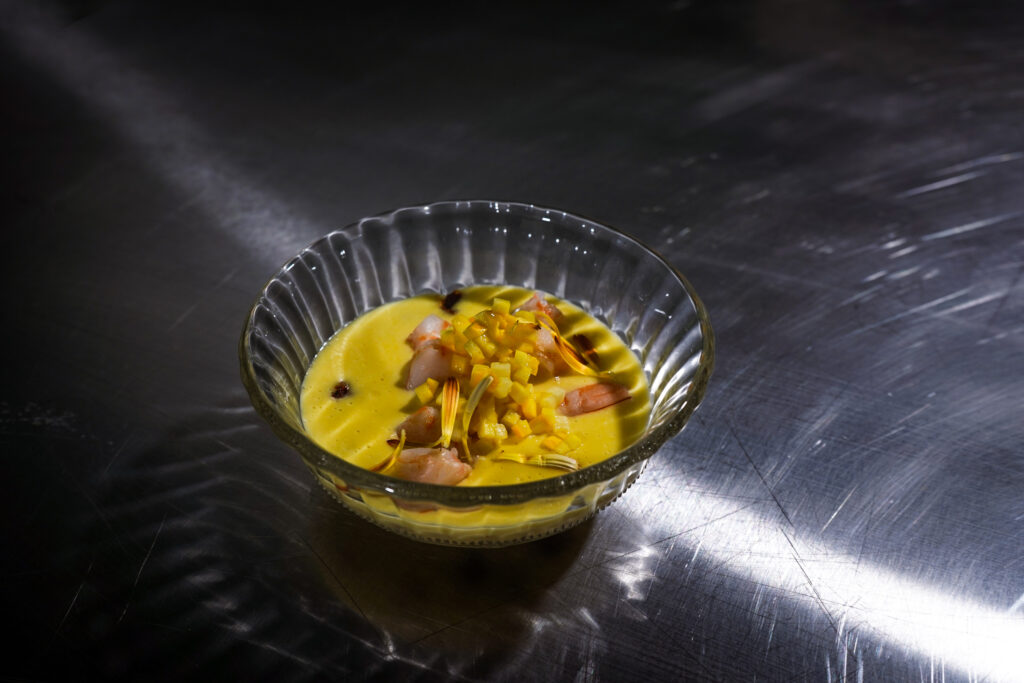 a bowl of soup with garnishes