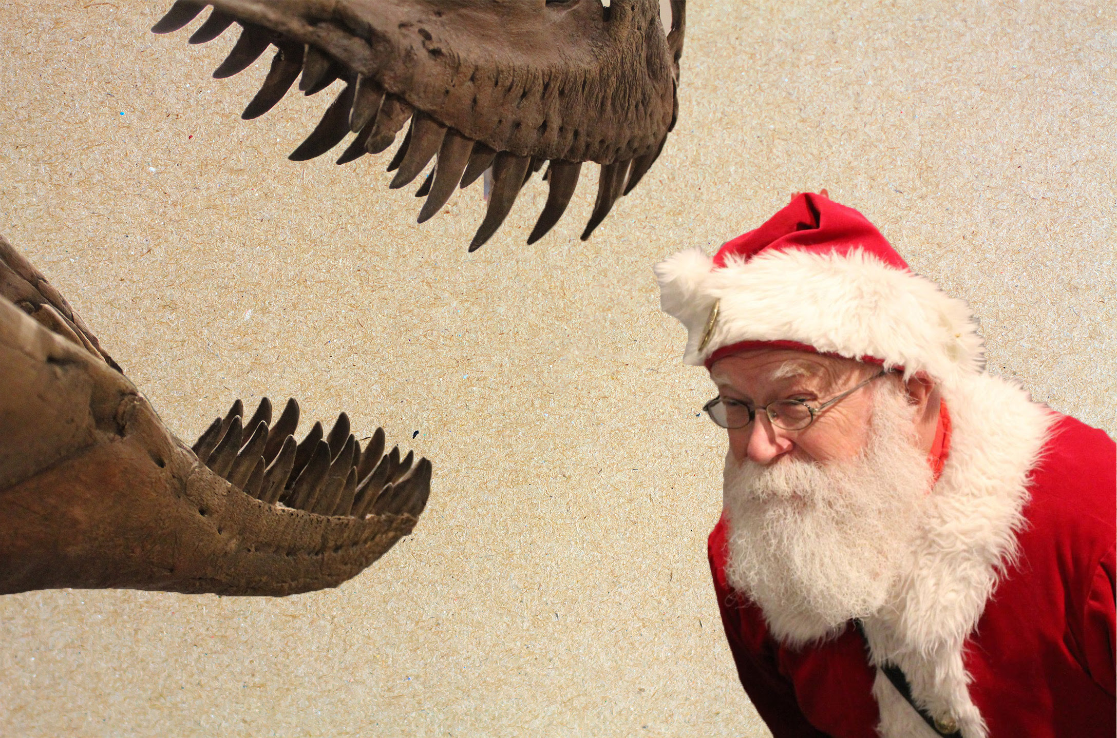 image of a Santa character next to a T-rex skeleton's head.