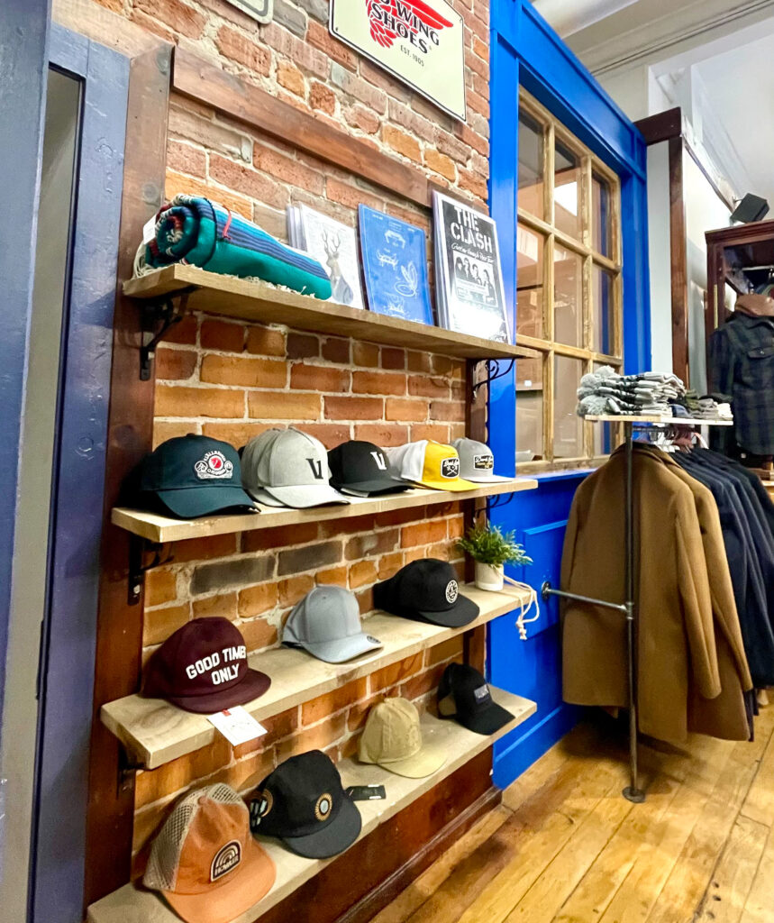 hats and jackets on display in a men's clothing store