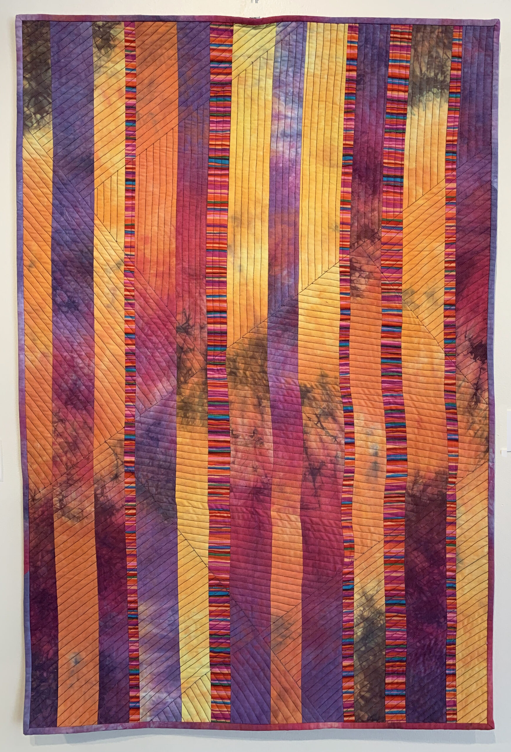 textile fabric art with orange and red colours