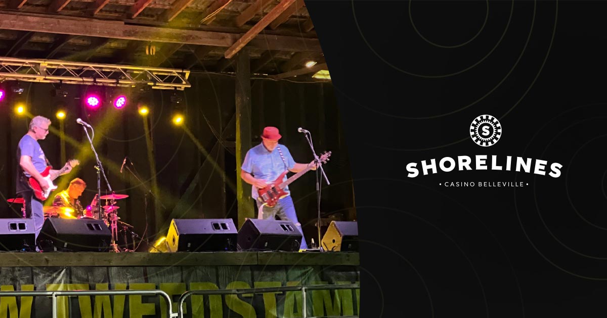 Poster with a photo of the band playing and the Shorelines logo