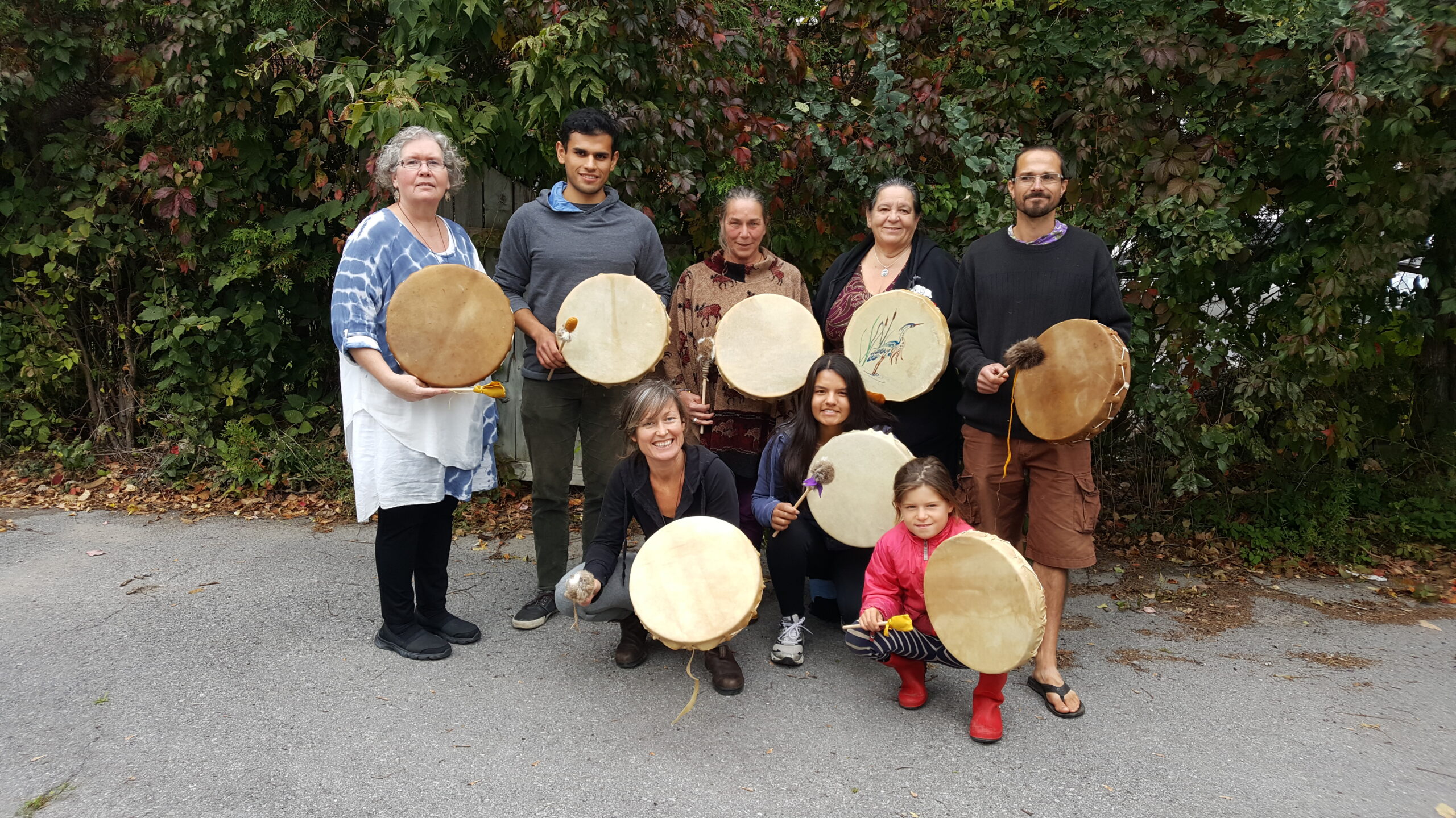 Photo of people with hand made drums.