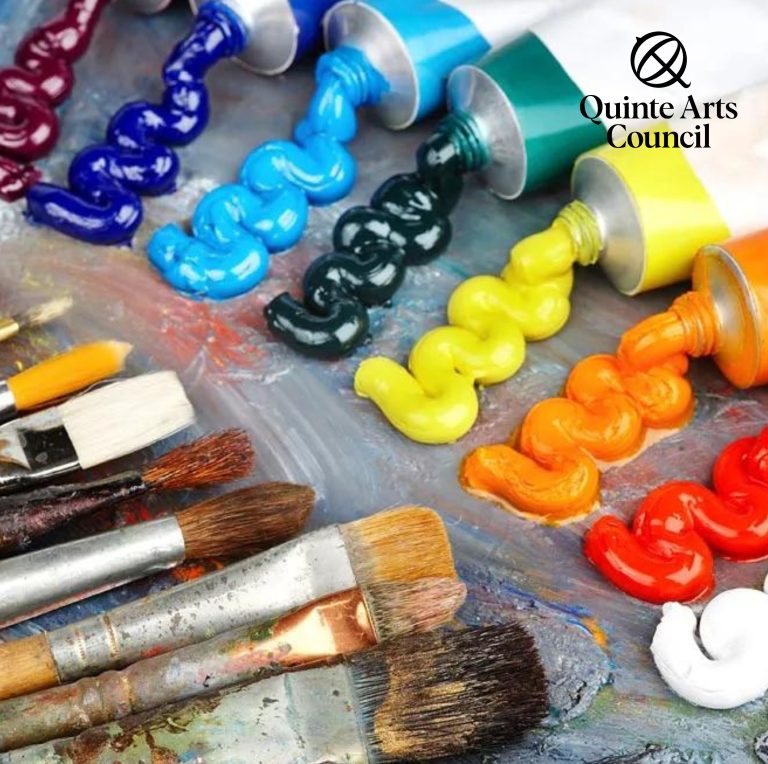 Photo of art supplies with QAC's logo as well