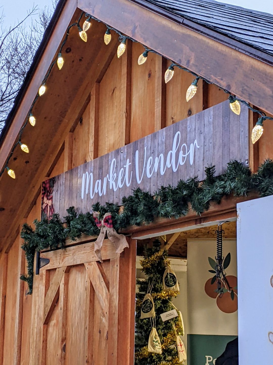 Photo of a vendor market booth with holiday decor.