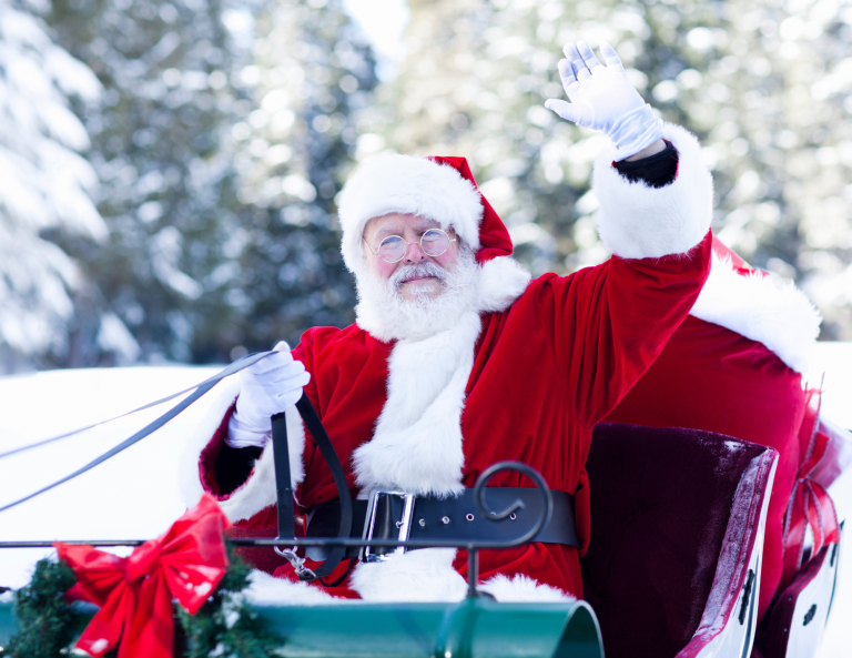 Photo of Santa Claus on a sleigh.