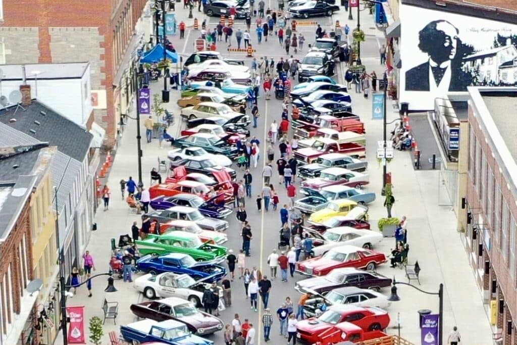 cars lined up in rows downtown for car show