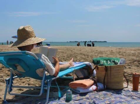 Image of person in a sunhat at the beach