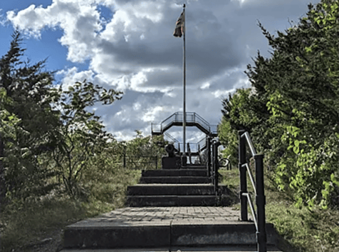Image of staircase leading to a flagpole and cannon