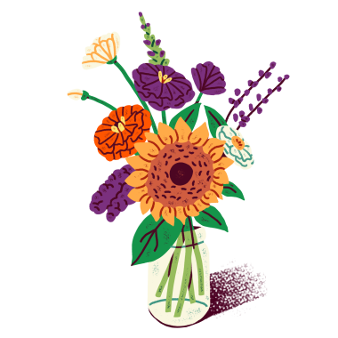 a vase filled with lots of colorful flowers.